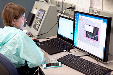 Scientist watching data from the 55 Tesla Mid-Pulse Magnet