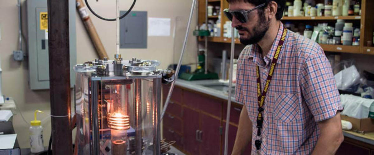 Ryan Baumbach monitors a crystal growth..