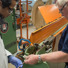 Research scientists Shreyas Balachandran (left) and William Starch draw lengths of niobium-tin superconducting wire at the Applied Superconductivity Center at the National High Magnetic Field Laboratory. A new grant of $1.5 million will allow the group to continue this research.