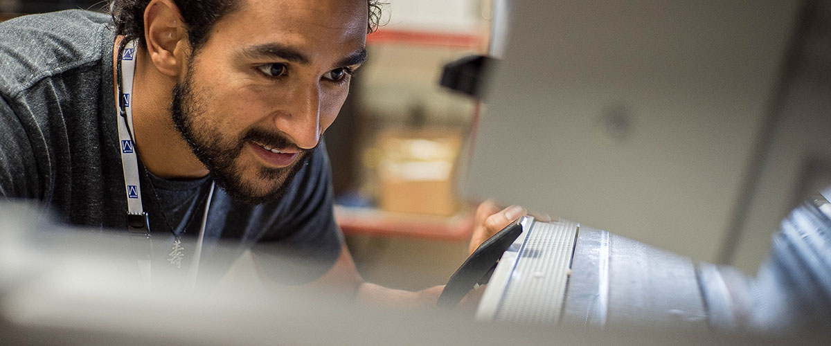 Charlie Sanabria checks on samples in the furnace.