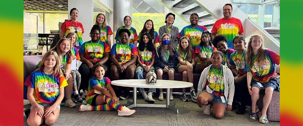 MagLab SciGirls group photo with MagLab educator, Carlos Villa (back row on the right). 