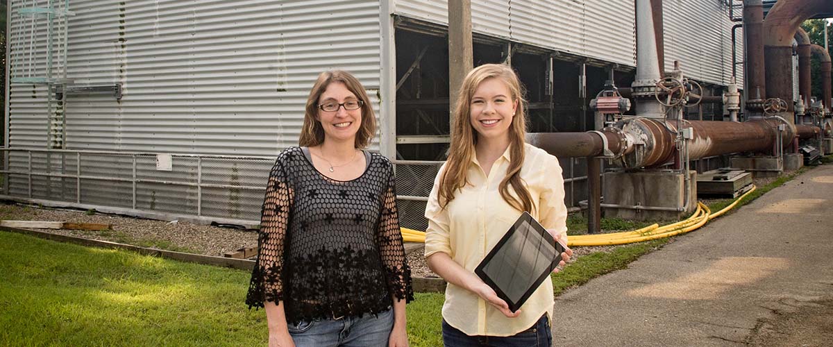 Julia Smith (left) and Abbey Centers (right) are testing the application on iPad.