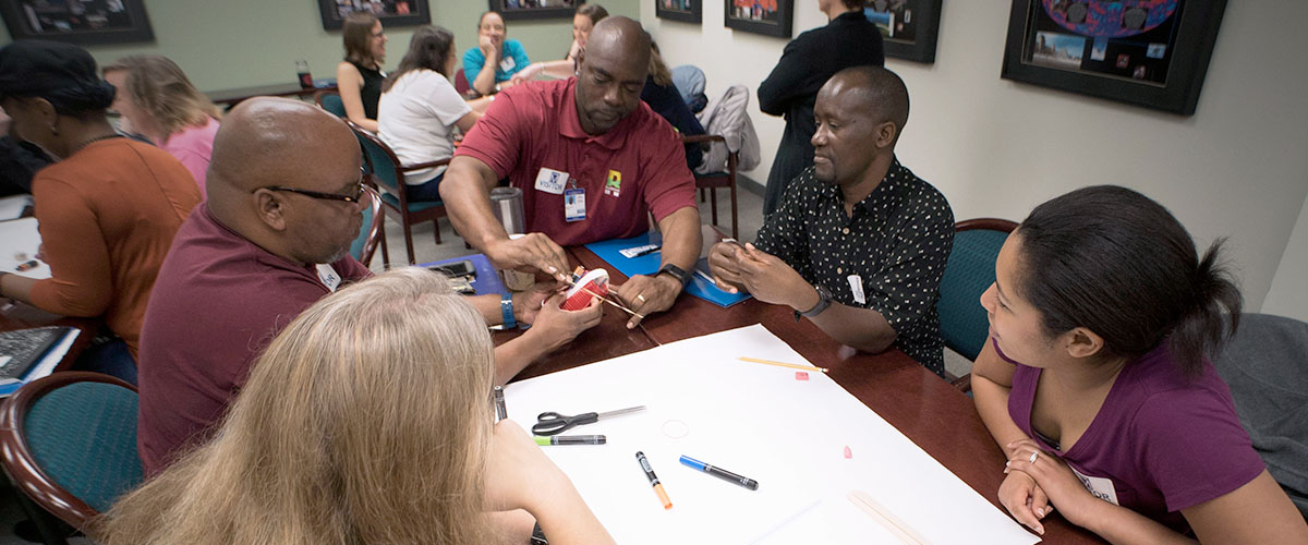 Teachers working on a group training project