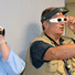 Scientist Bob Goddard (center) and two of the teachers he mentored use 3-D glasses to examine images outside his lab.