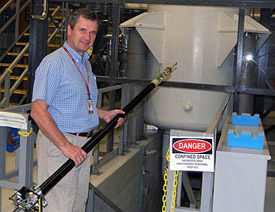 MagLab scientist Victor Schepkin prepares to insert a probe in the 900 MHz NMR magnet.