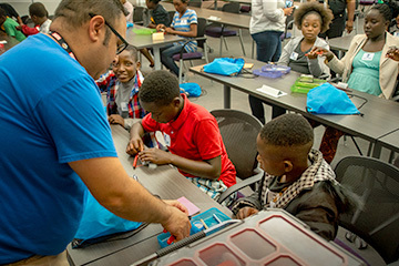 MagLab Staff doing interactive demos with visiting elementary students