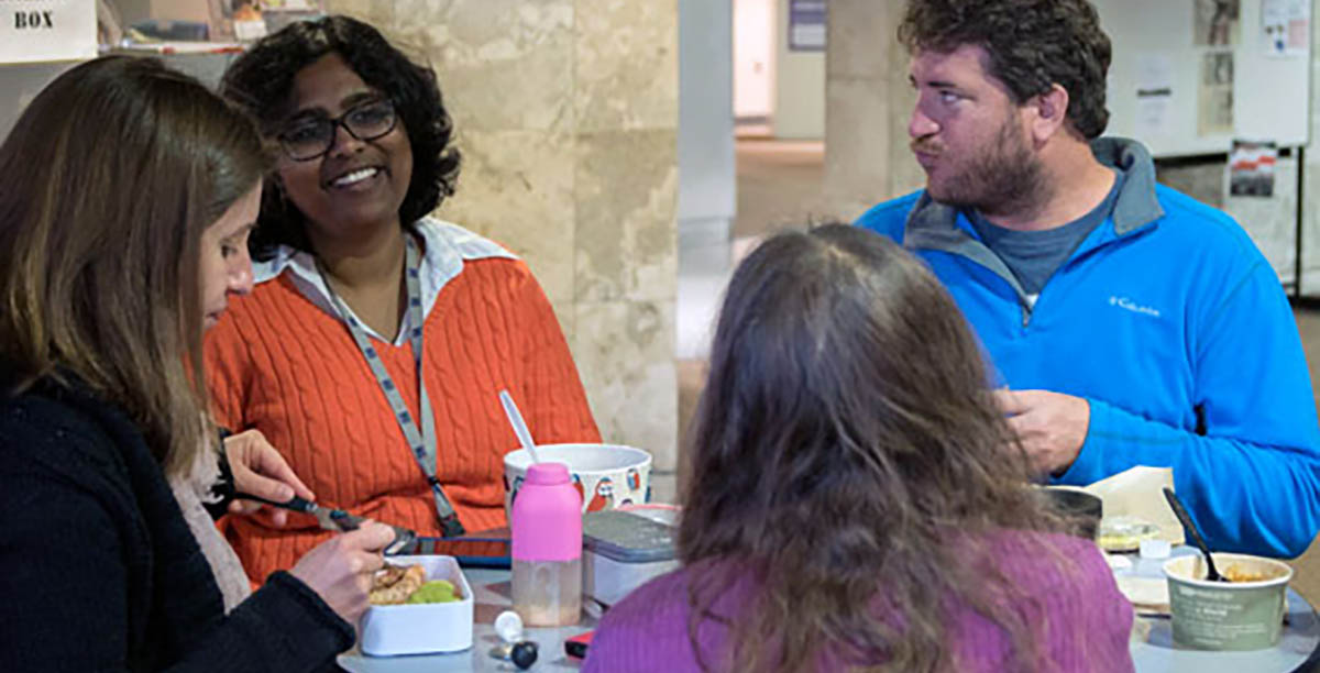 MagLab scientist  Komalavalli Thirunavukkuarasu (second from left) shares stories over lunch with a group of postdocs.