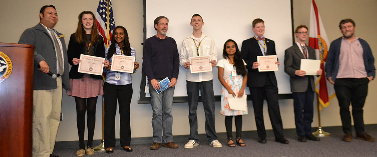 Middle schoolers with their certificates