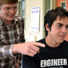 Jeremy Weiss, a young MagLab materials scientist and mentor, points to some of the data plotted by MagLab intern Gerardo Nazario.